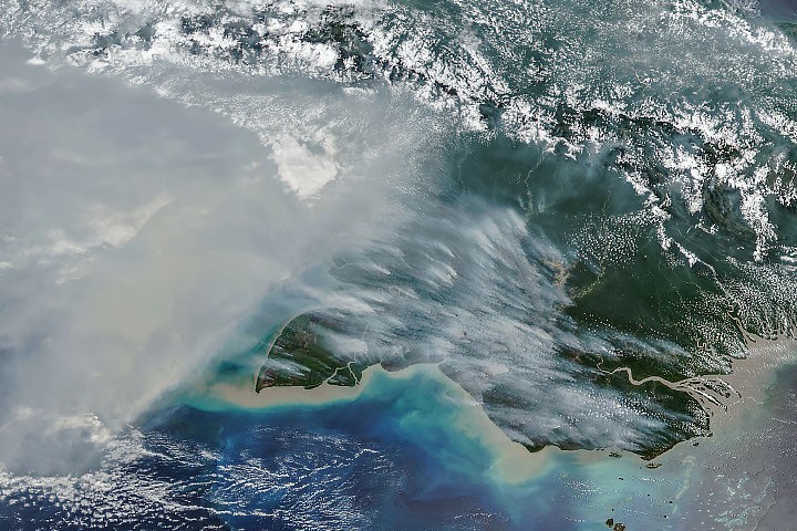 Satellite view of smoke and fires in New Guinea on 11 October 2026